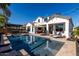 Beautiful backyard featuring a pool, covered patio, and outdoor seating, perfect for enjoying the outdoors at 5212 S Seton Ct, Gilbert, AZ 85298