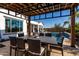 Relaxing backyard with a pergola-covered dining area and a refreshing pool, perfect for outdoor enjoyment at 5212 S Seton Ct, Gilbert, AZ 85298