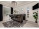 Stylish home bar with a dark wood counter, modern lighting, three stools, and a decorative wine rack at 5212 S Seton Ct, Gilbert, AZ 85298