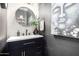 Elegant powder room featuring a modern vanity, unique fixtures, and stylish decor at 5212 S Seton Ct, Gilbert, AZ 85298