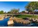 Scenic view of the community green space with mature trees and a well-maintained lawn at 5212 S Seton Ct, Gilbert, AZ 85298