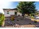 Charming single-story home featuring desert landscaping and a stone facade, creating a welcoming curb appeal at 5212 S Seton Ct, Gilbert, AZ 85298