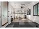 Spacious home gym featuring modern equipment, a ceiling fan, and neutral colors for a motivating workout space at 5212 S Seton Ct, Gilbert, AZ 85298