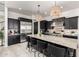 Modern kitchen with stainless steel appliances, granite countertops, and a large central island at 5212 S Seton Ct, Gilbert, AZ 85298