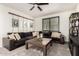 This living room boasts a large sectional sofa and a wooden coffee table for gatherings at 5212 S Seton Ct, Gilbert, AZ 85298