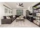 Inviting living room features a large sectional sofa, stylish decor, and neutral carpeting at 5212 S Seton Ct, Gilbert, AZ 85298