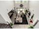 This living room features an open floor plan, fireplace and large windows at 5212 S Seton Ct, Gilbert, AZ 85298