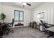 Bright home office featuring a large window, neutral carpet, and two separate desks for work at 5212 S Seton Ct, Gilbert, AZ 85298