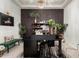 Stylish home office featuring a large black desk, modern decor, and ample lighting for a productive workspace at 5212 S Seton Ct, Gilbert, AZ 85298