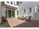 Relaxing outdoor patio with stylish furniture, string lights, and a private courtyard entrance at 5212 S Seton Ct, Gilbert, AZ 85298