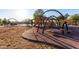 Fun and colorful playground area with various climbing structures and a soft landing surface at 5212 S Seton Ct, Gilbert, AZ 85298