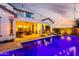Beautiful backyard pool and patio featuring lounge chairs, a built-in grill, and string lights for evening ambiance at 5212 S Seton Ct, Gilbert, AZ 85298