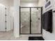 The shower in this bathroom features black hardware, mosaic tile and a built-in bench at 5212 S Seton Ct, Gilbert, AZ 85298