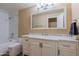 Bathroom features a vanity with white marble countertops, and a shower and bath combination at 5345 E Van Buren St # 307, Phoenix, AZ 85008