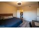 Bedroom featuring a queen bed, balcony access and a walk-in closet at 5345 E Van Buren St # 307, Phoenix, AZ 85008