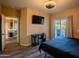The bedroom features a cozy queen bed, and a dedicated workspace with a street view balcony at 5345 E Van Buren St # 307, Phoenix, AZ 85008