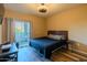 A bedroom with a queen bed, balcony access, and comfortable furnishings at 5345 E Van Buren St # 307, Phoenix, AZ 85008