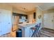 Modern kitchen with stainless steel appliances, a breakfast bar, and sleek countertops at 5345 E Van Buren St # 307, Phoenix, AZ 85008