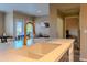 A modern kitchen with white marble countertops and dark cabinets, and stainless steel appliances at 5345 E Van Buren St # 307, Phoenix, AZ 85008
