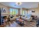 Cozy living room with plush seating, modern lighting, and a fireplace for relaxed living at 5345 E Van Buren St # 307, Phoenix, AZ 85008