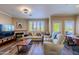 Welcoming living room with ample seating, a fireplace, and plenty of natural light for comfortable living at 5345 E Van Buren St # 307, Phoenix, AZ 85008