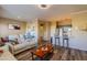 Open-concept living space featuring sleek flooring, a cozy seating area, and modern lighting at 5345 E Van Buren St # 307, Phoenix, AZ 85008
