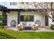 Cozy back patio featuring a comfortable seating area with egg chairs and an outdoor sofa at 5929 E Indian School Rd, Phoenix, AZ 85018