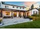 Elegant outdoor patio with comfortable seating, a built-in grill, and stylish string lights for evening ambiance at 5929 E Indian School Rd, Phoenix, AZ 85018