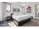 Bright bedroom with modern decor, white curtains and decorative shelving at 5929 E Indian School Rd, Phoenix, AZ 85018
