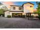 Contemporary home with a spacious three-car garage and a well-maintained paved driveway at 5929 E Indian School Rd, Phoenix, AZ 85018