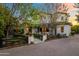 Inviting home featuring a charming entrance and mature trees creating a welcoming ambiance at 5929 E Indian School Rd, Phoenix, AZ 85018