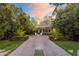 Stunning home with lush landscaping, a paved driveway, and an inviting entrance for curb appeal at 5929 E Indian School Rd, Phoenix, AZ 85018