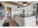 Stylish kitchen with a large island, modern fixtures, stainless appliances, and an open layout to dining at 5929 E Indian School Rd, Phoenix, AZ 85018