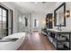 Spacious main bathroom with soaking tub, glass enclosed shower and dual vanities at 5929 E Indian School Rd, Phoenix, AZ 85018