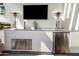 Outdoor kitchen featuring stainless steel appliances, a TV and decorative accents at 5929 E Indian School Rd, Phoenix, AZ 85018