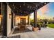 Outdoor patio with pendant lights, modern furniture and custom ping pong table at 5929 E Indian School Rd, Phoenix, AZ 85018
