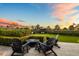 Beautiful outdoor patio with fire pit, chairs, manicured landscaping and tranquil ambiance, ideal for relaxing evenings at 5929 E Indian School Rd, Phoenix, AZ 85018