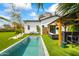 Inviting backyard pool with lounge chairs and a covered outdoor living area at 5929 E Indian School Rd, Phoenix, AZ 85018