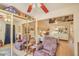 Spacious bedroom with hardwood floors, ceiling fan, and generous mirrored closet, offering storage and style at 6102 E Inglewood St, Mesa, AZ 85205