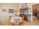 Cozy dining room featuring a wooden table with seating for four and decorative china cabinet at 6102 E Inglewood St, Mesa, AZ 85205