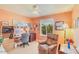 Cozy office featuring hardwood floors, a ceiling fan, and a comfortable recliner, creating a productive workspace at 6102 E Inglewood St, Mesa, AZ 85205