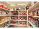 Well-stocked pantry with organized shelves, providing ample storage for groceries and kitchen essentials at 6102 E Inglewood St, Mesa, AZ 85205