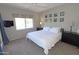 Relaxing bedroom features a large window, comfortable bed, and stylish decor at 7021 E Earll Dr # 204, Scottsdale, AZ 85251