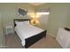Bedroom with a neutral color scheme, comfortable bed, and decorative artwork at 7021 E Earll Dr # 204, Scottsdale, AZ 85251
