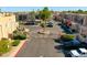 Gated community entrance with lush landscaping, a fountain, and well-maintained street at 7021 E Earll Dr # 204, Scottsdale, AZ 85251