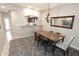 Bright dining room features modern lighting, stylish rug, and access to the kitchen at 7021 E Earll Dr # 204, Scottsdale, AZ 85251