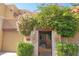 Charming condo entrance with vibrant flowering bushes, offering a welcoming and picturesque curb appeal at 7021 E Earll Dr # 204, Scottsdale, AZ 85251