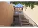 Exterior stairway leading to a second-level condo, showcasing modern design and accessibility at 7021 E Earll Dr # 204, Scottsdale, AZ 85251