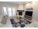 Cozy living room boasts a white brick fireplace, access to a patio, and comfortable seating at 7021 E Earll Dr # 204, Scottsdale, AZ 85251