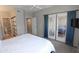 Serene main bedroom boasts a large bed, en-suite bathroom, and patio access at 7021 E Earll Dr # 204, Scottsdale, AZ 85251